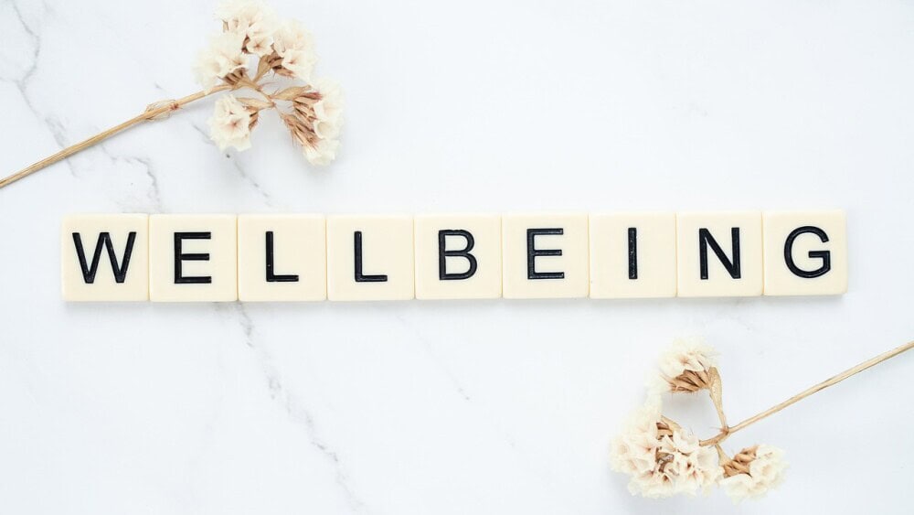 blocks that spell out the word wellbeing 